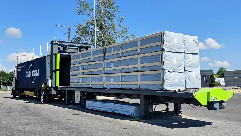 Automated container loading system loading wood into container