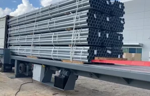 Metal tube unloading from container