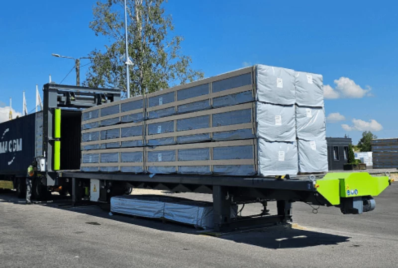 Our automated sliding floor system loading packaged wood products into a container