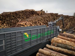 Log loading system on tracks