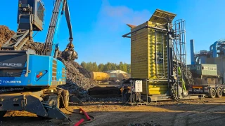 Loading metal scrap with container tilter